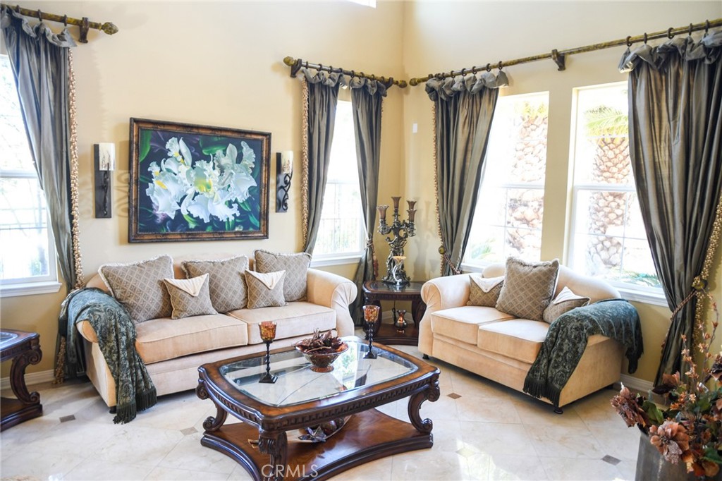 20370 Vía Cellini Porter Ranch, CA 91326 - Photo 3 of 17 a living room with furniture and a large window