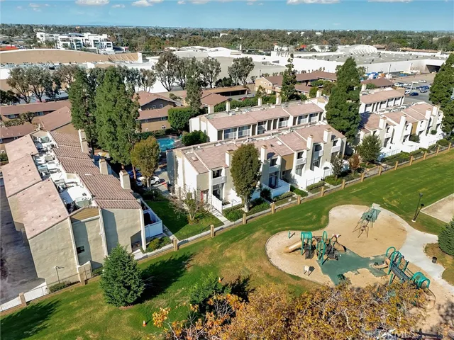 an aerial view of a house with yard swimming pool and outdoor seating
