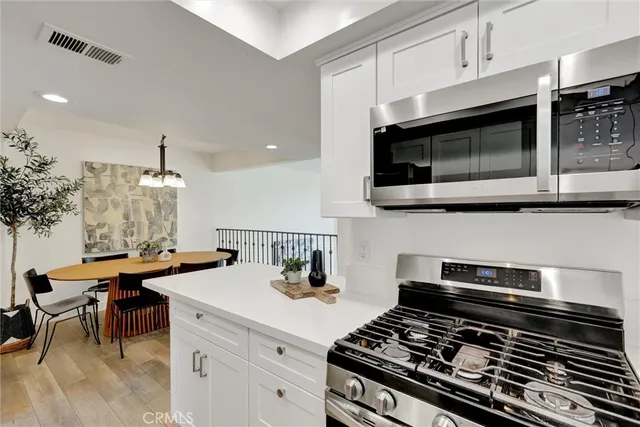 a kitchen with a stove and a microwave