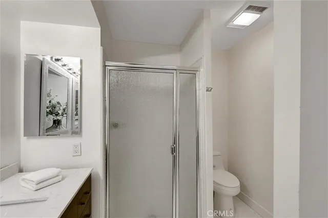 aerial view of a house with a yard and potted plants