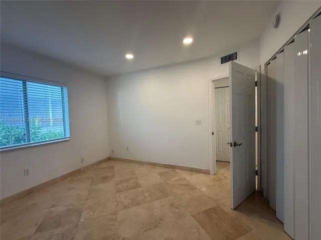 a view of a bench in a garden