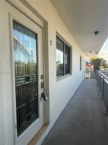 a kitchen with granite countertop stainless steel appliances and wooden cabinets