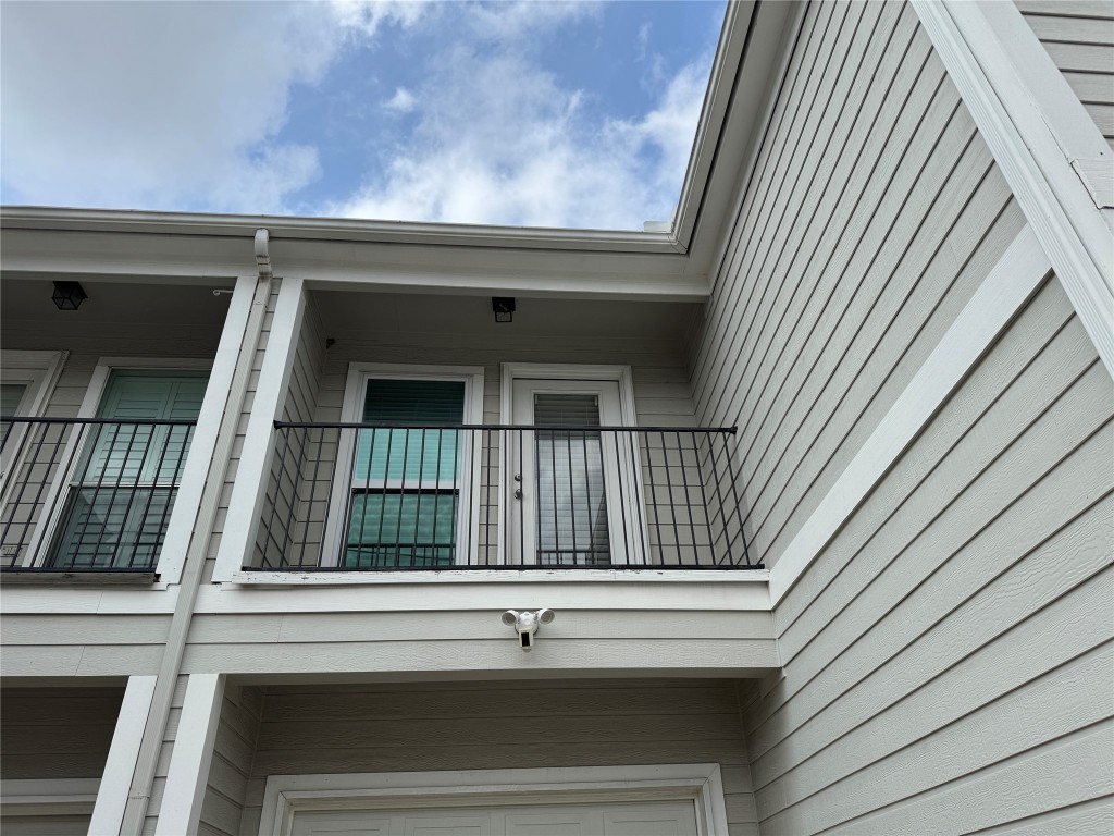 1908 Bailey Street Houston, TX 77006 - Photo 20 of 40 You can see the garage door and the balcony for the secondary bedroom. You only have one neighbor with an attached wall. The corner unit offers so much more natural light and privacy.