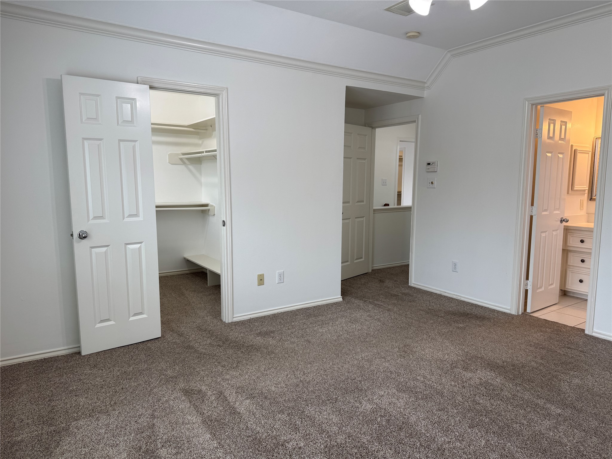 1908 Bailey Street Houston, TX 77006 - Photo 25 of 40 You see the entry to the primary bedroom, the large walk-in closet and the en suite bath.