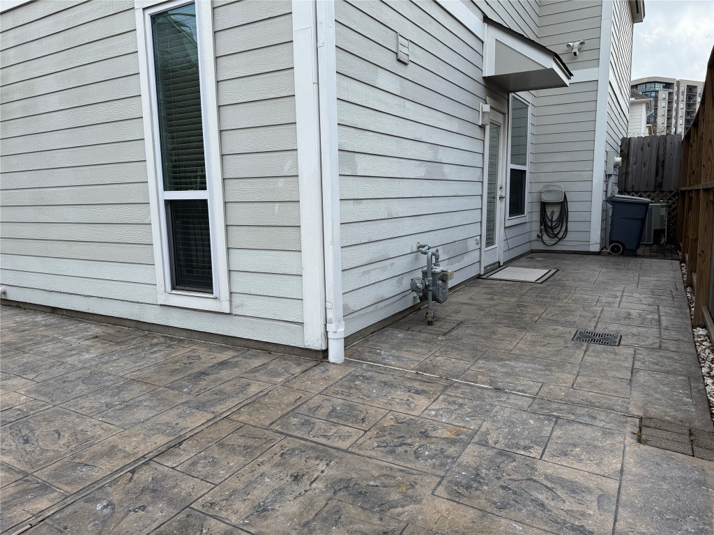 1908 Bailey Street Houston, TX 77006 - Photo 33 of 40 The patio has been enlarged so you have lots of space for a table and chairs. The AC is tucked back out of the way and you have room to store your garbage cans behind the garage.