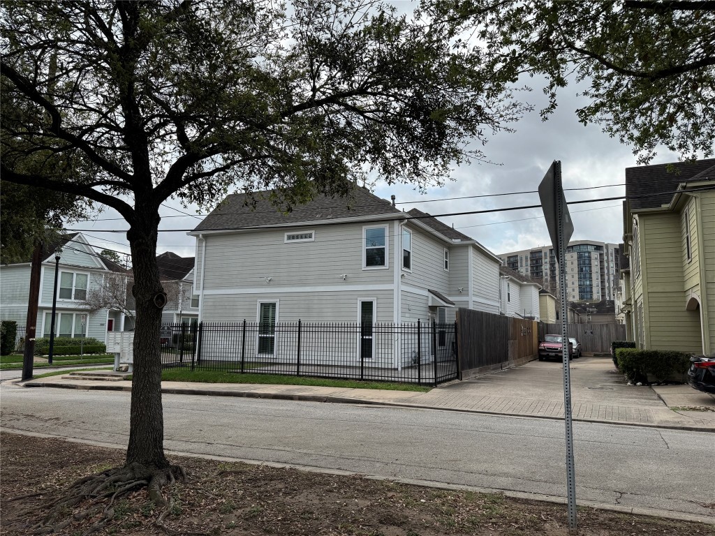 1908 Bailey Street Houston, TX 77006 - Photo 36 of 40 This is the side of your place, showing your wrap around fenced yard. There's a paved area for a table and chairs and you have space to cook out and store your trash cans.