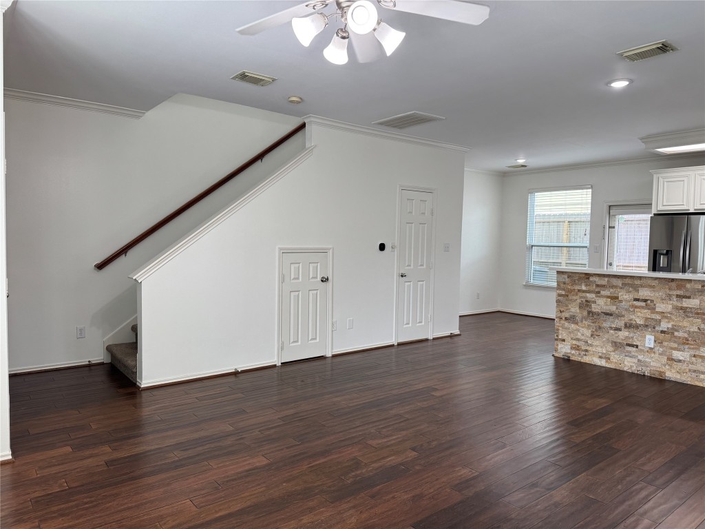 1908 Bailey Street Houston, TX 77006 - Photo 4 of 40 This is taken from the living room, looking toward the dining area. Your garage door is just around the corner from the taller door, which is the powder bath. The smaller door has a storage area under the stairs.