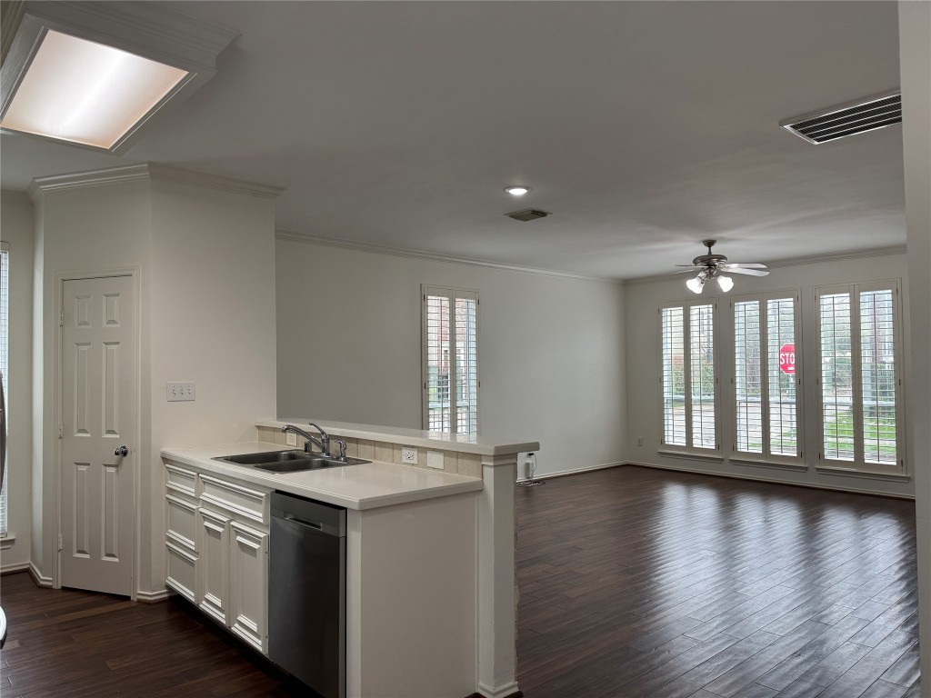 1908 Bailey Street Houston, TX 77006 - Photo 7 of 40 This is taken from the dining area, looking toward the kitchen and into the living room. You get crown moulding and Plantation shutters. The interior was freshly painted.