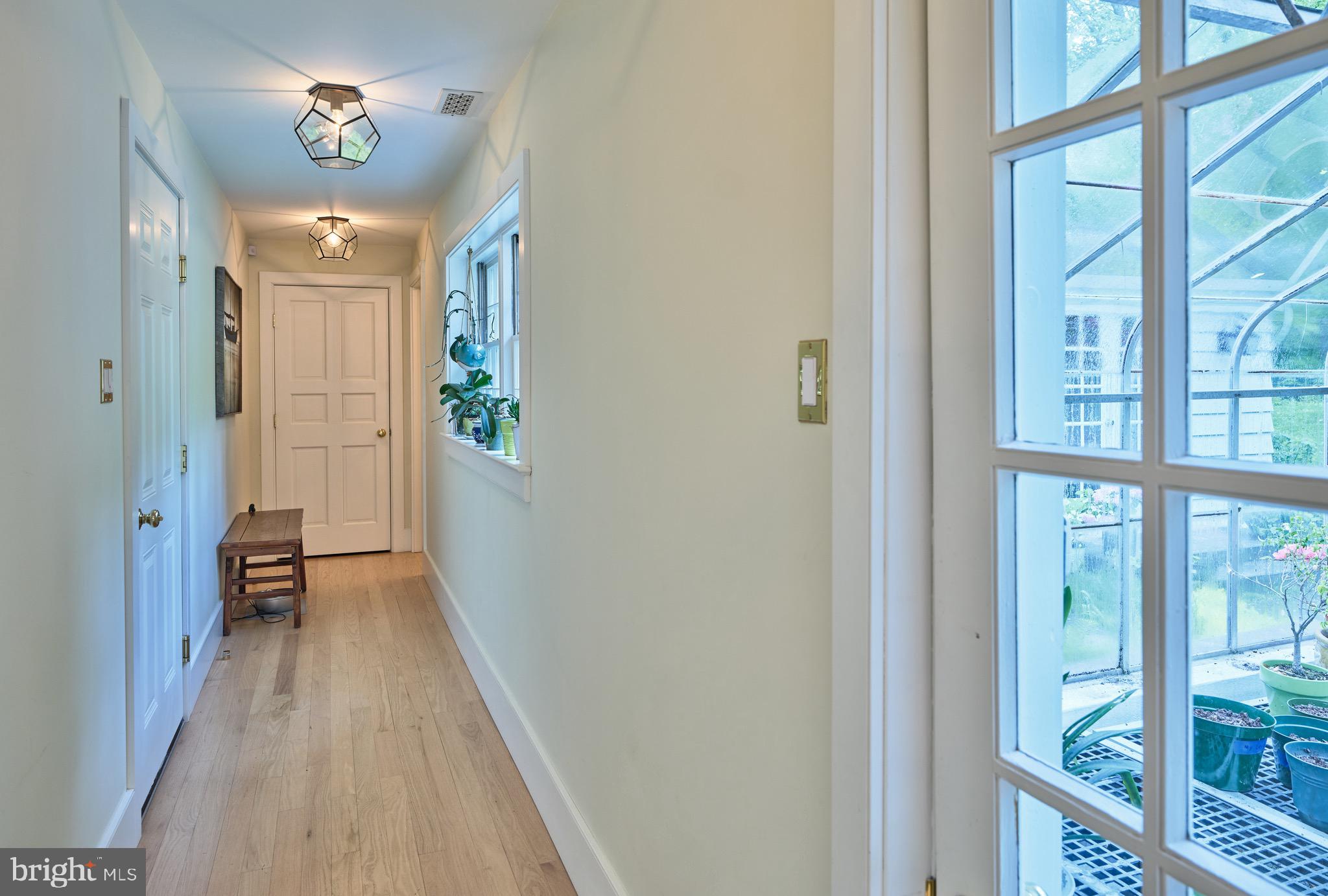 3363 Windy Bush Road New Hope, PA 18938 - Photo 23 of 40 Hallway to primary and greenhouse and garage