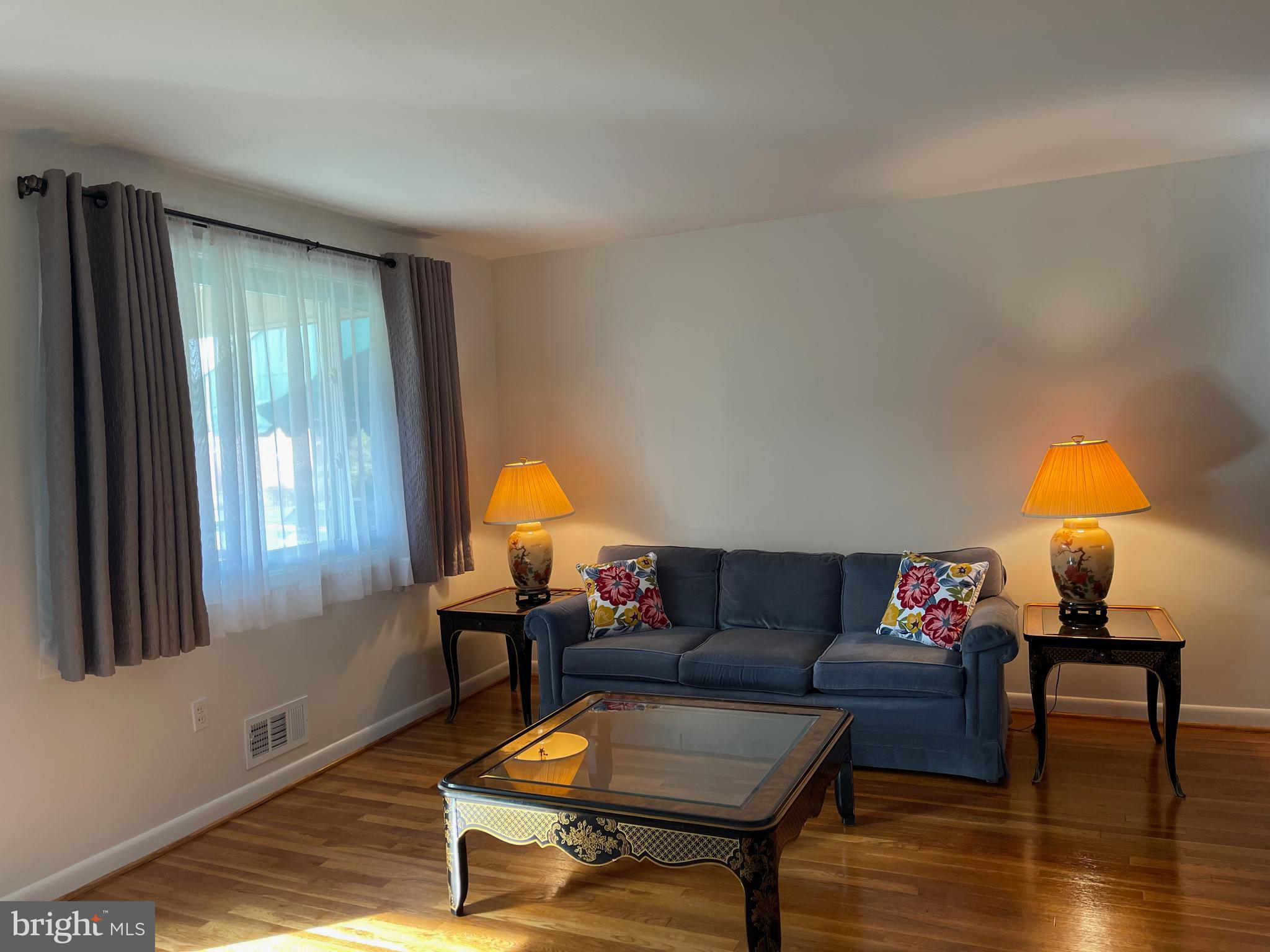 8507 Kings Ridge Road Parkville, MD 21234 - Photo 5 of 34 Living room large picture window, custom drapes