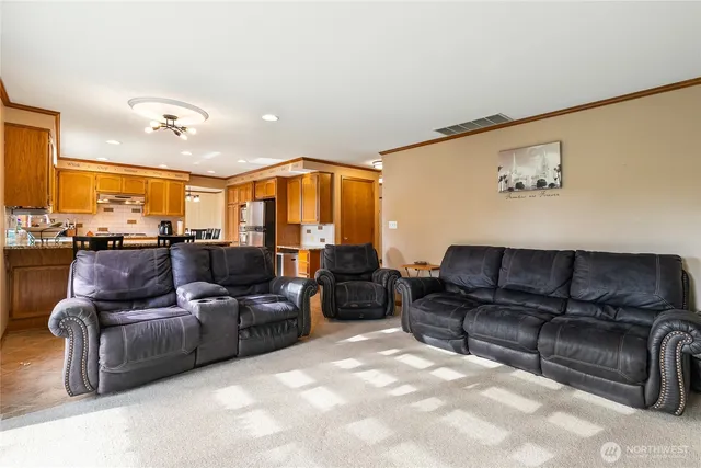 a living room with furniture and a couch