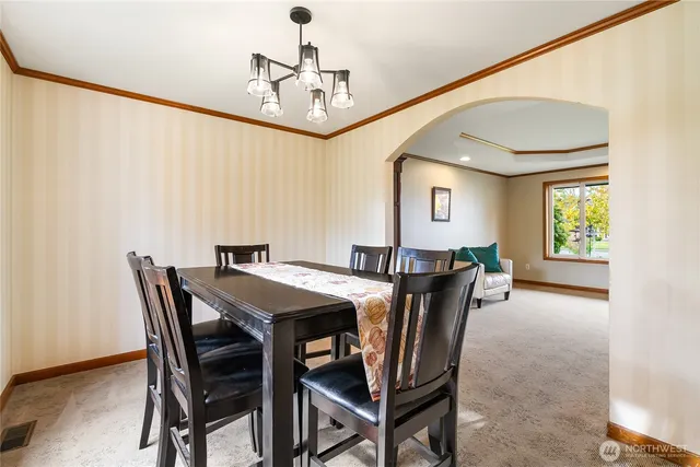 a dining room with furniture and window