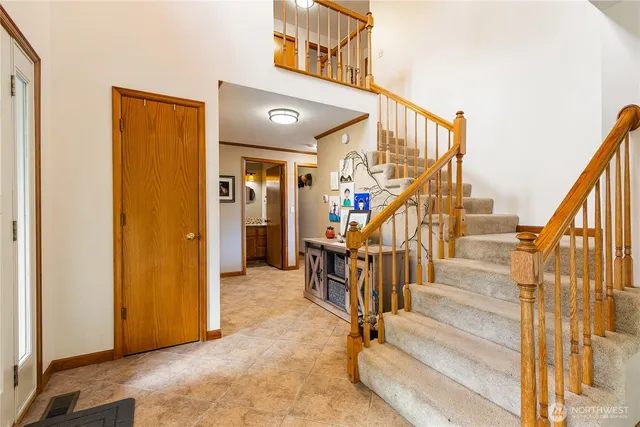 a view of a hallway with staircase