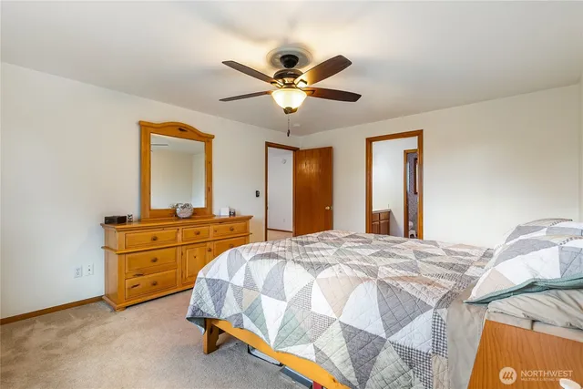 a bedroom with a bed and a dresser