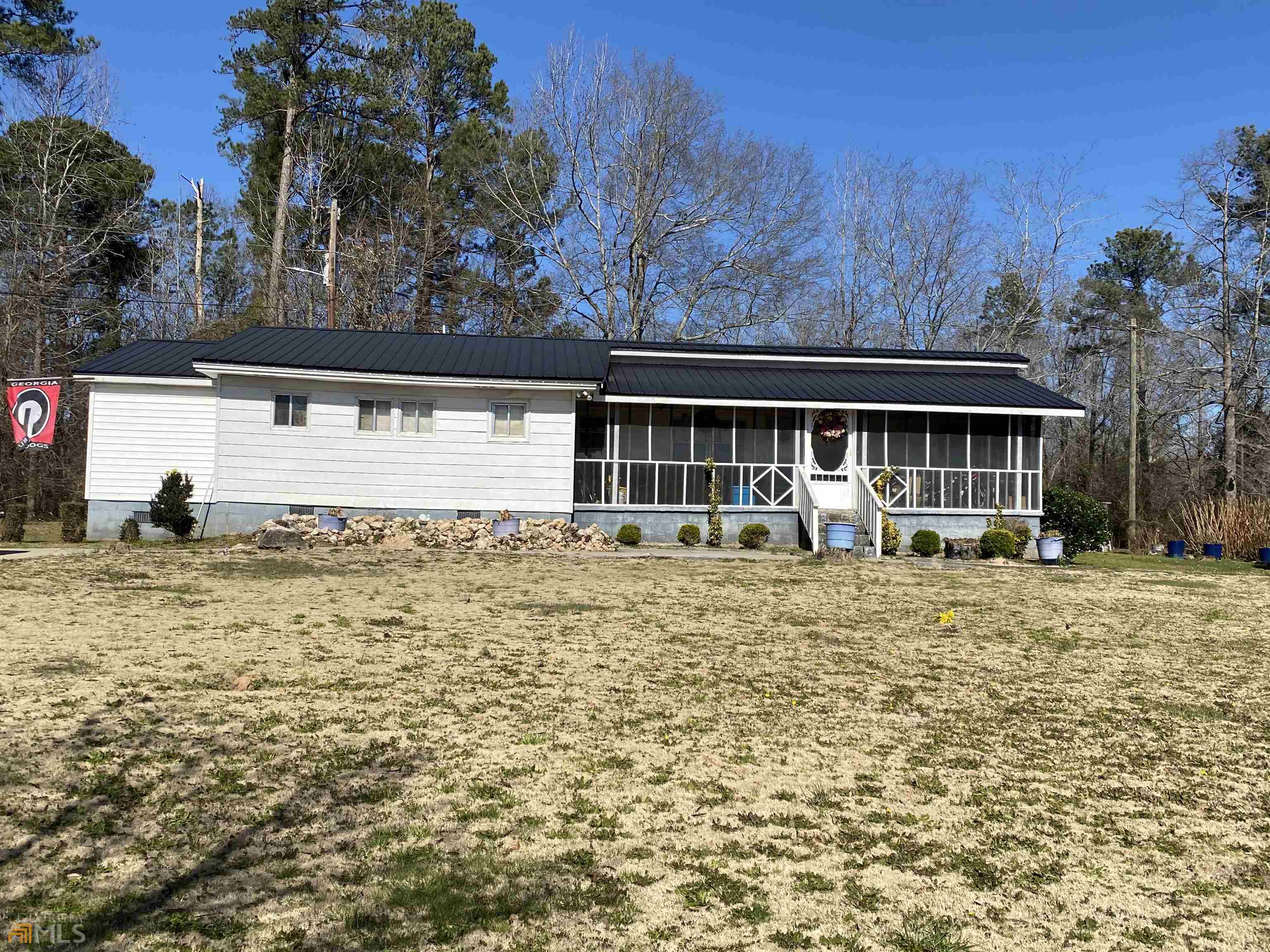 203 Fairground Road Lexington, GA 30648 - Photo 1 of 1 a front view of a house with garden