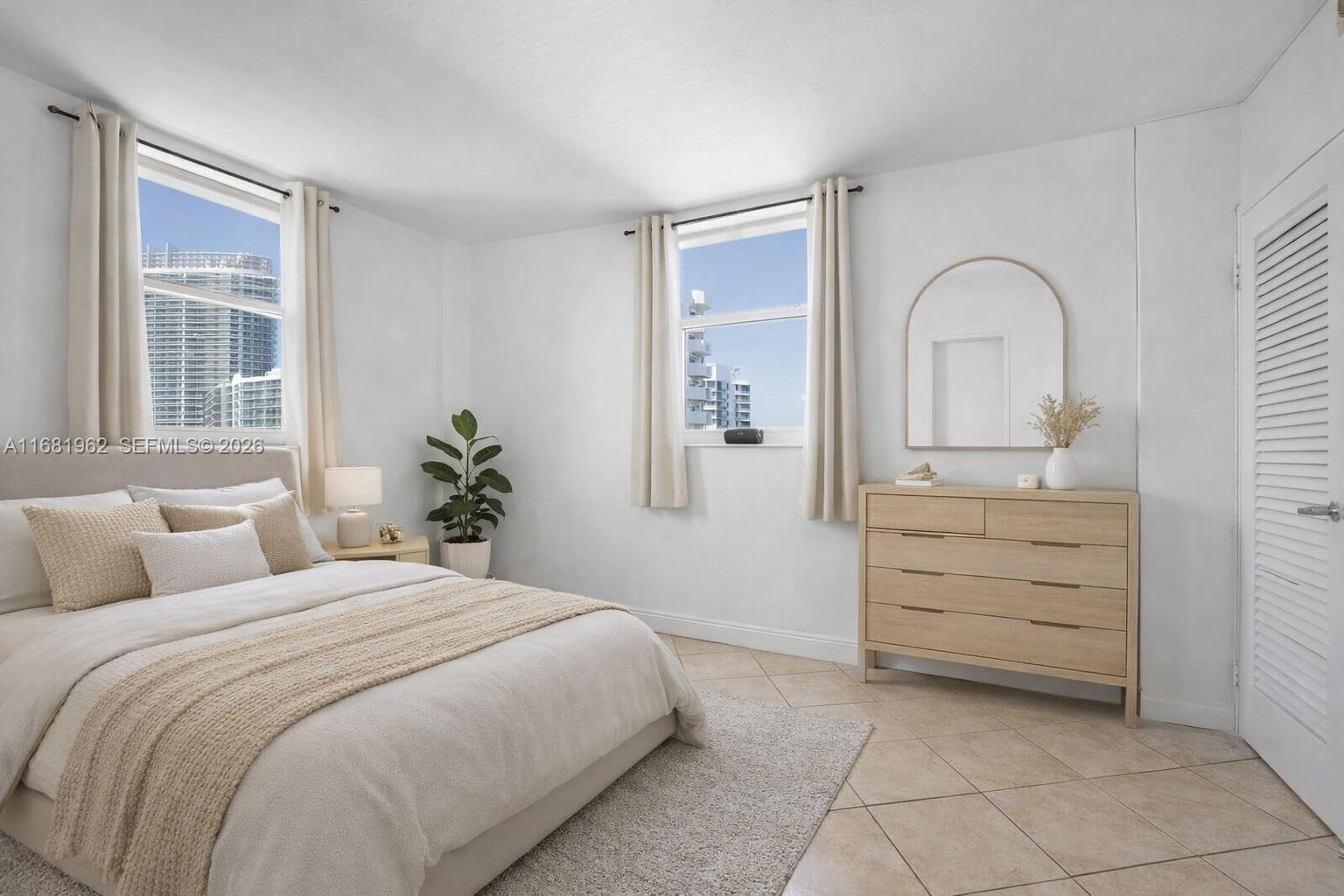 1300 Lincoln Road, Unit A701 Miami Beach, FL 33139 - Photo 11 of 36 a bedroom with a bed and a dresser
