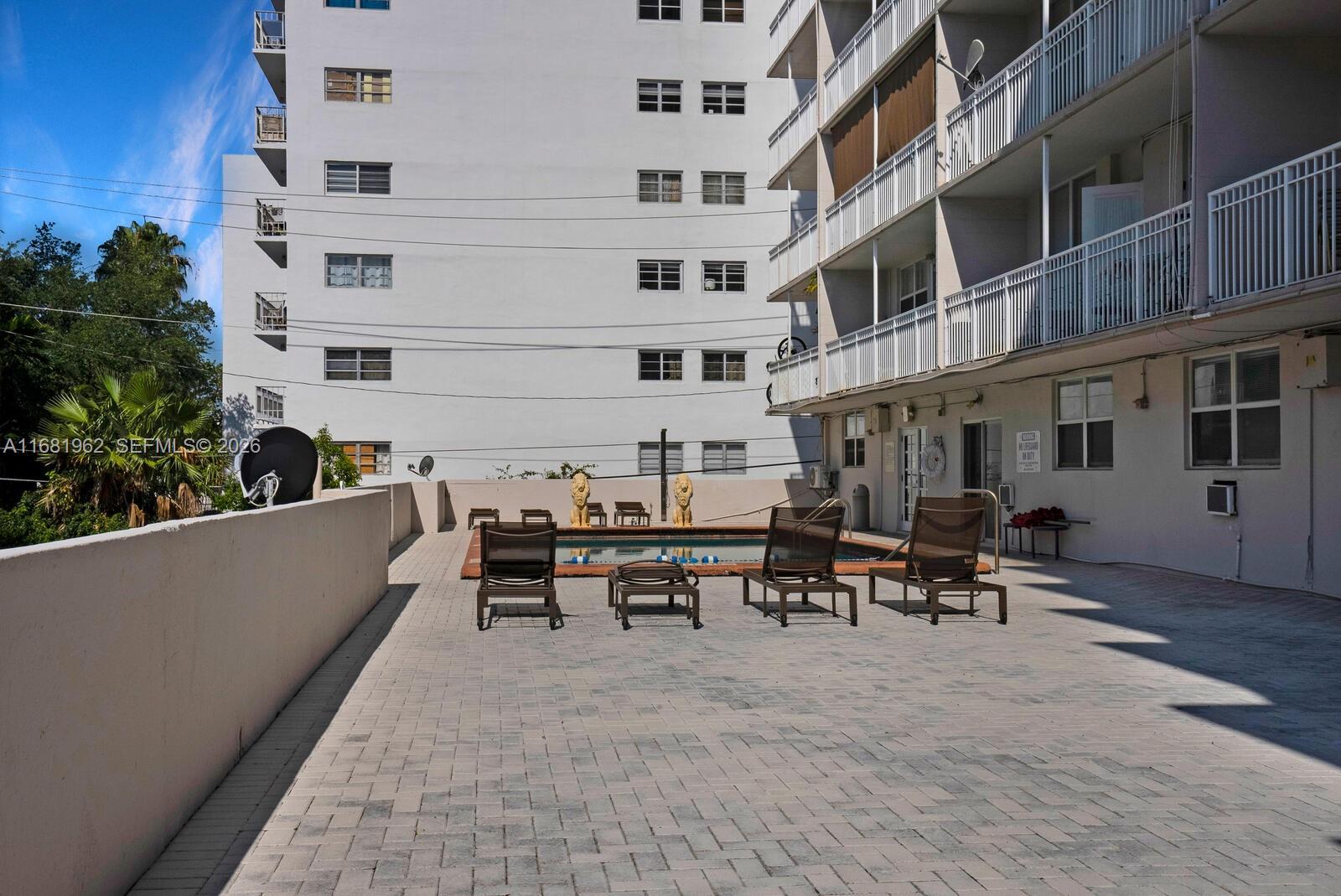 1300 Lincoln Road, Unit A701 Miami Beach, FL 33139 - Photo 20 of 36 a view of a building with sitting area