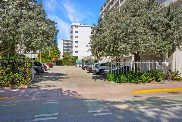 a view of street with parked cars