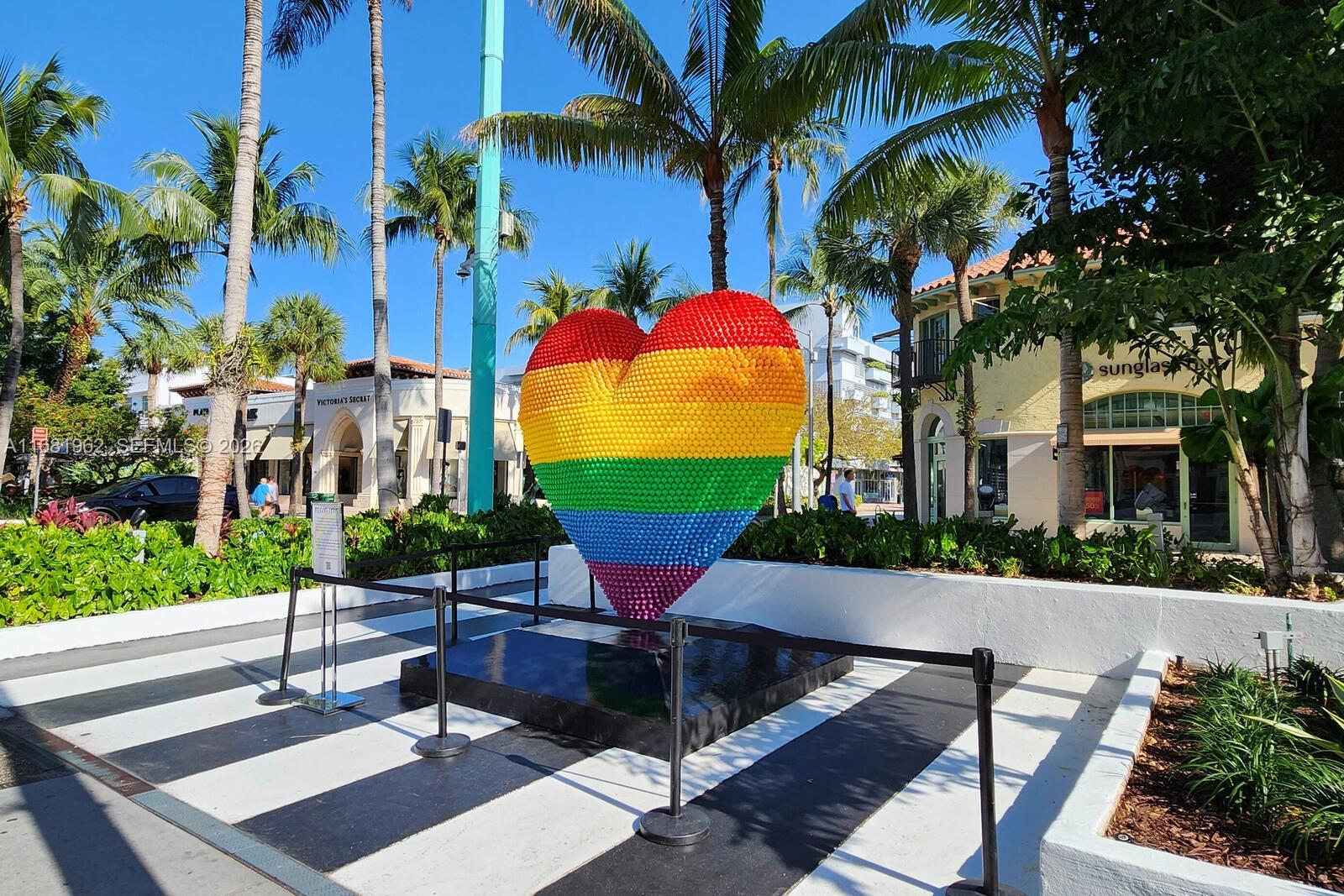 1300 Lincoln Road, Unit A701 Miami Beach, FL 33139 - Photo 27 of 36 a view of a patio with a table and chairs under an umbrella