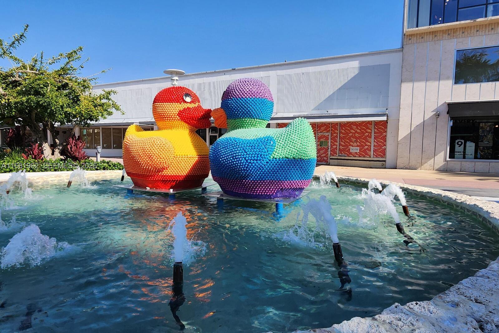 1300 Lincoln Road, Unit A701 Miami Beach, FL 33139 - Photo 30 of 36 a view of a backyard with table and chairs potted plants