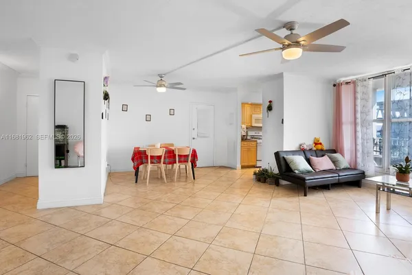 a living room with furniture and white walls