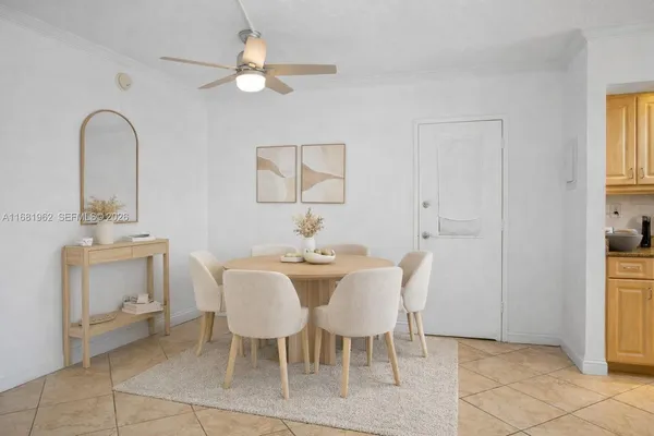 a dining room with furniture and window
