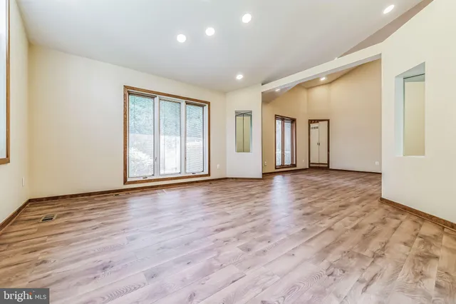 a bedroom with a bed and a table in it