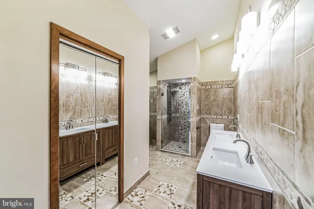 a white bath tub sitting in a bathroom next to a shower