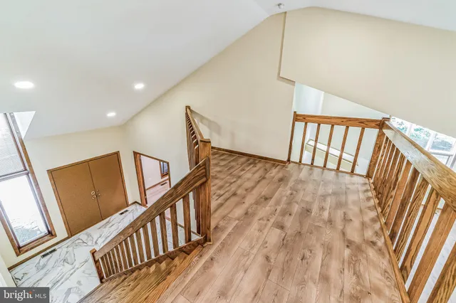 a view of staircase with wooden floor and stairs