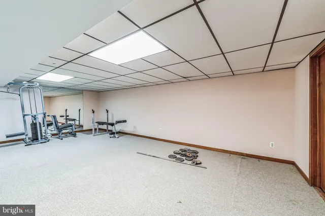 a view of an empty room with stairs