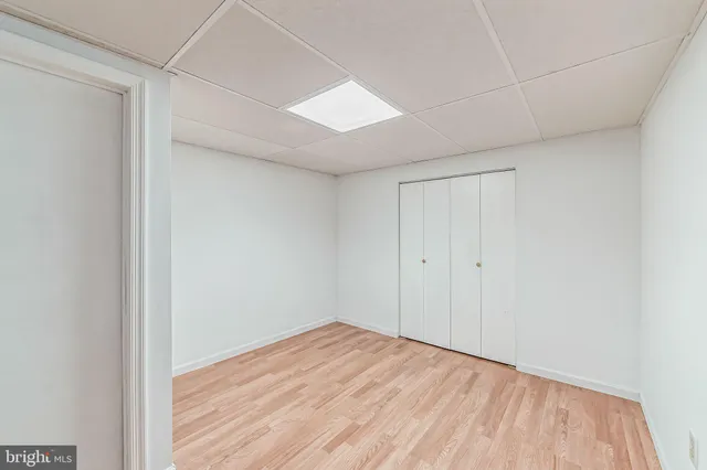a view of a patio with table and chairs potted plants with wooden fence