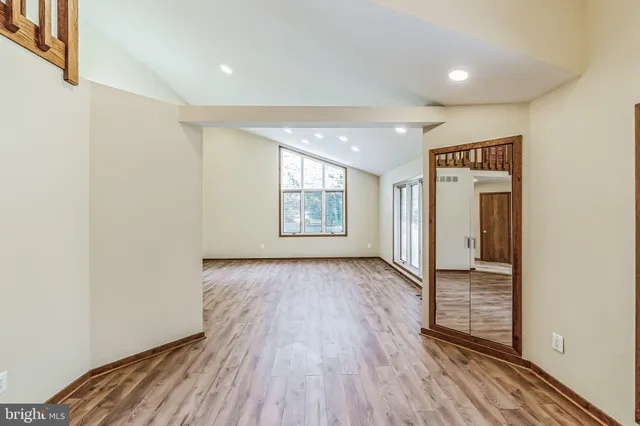 a view of hallway with wooden floor