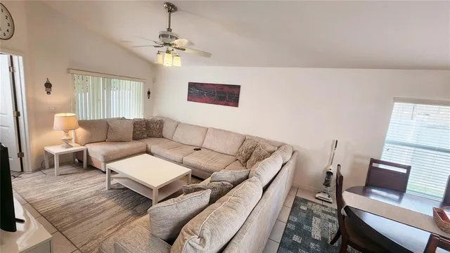 a living room with furniture and a window