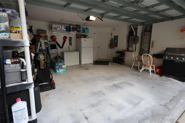 a kitchen with a sink cabinets and wooden floor