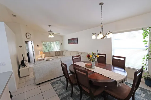 a dining room with furniture and window