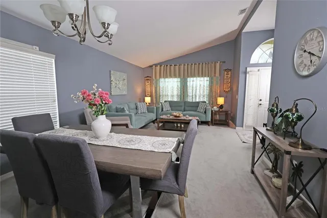 a front view of a house with a garden and garage