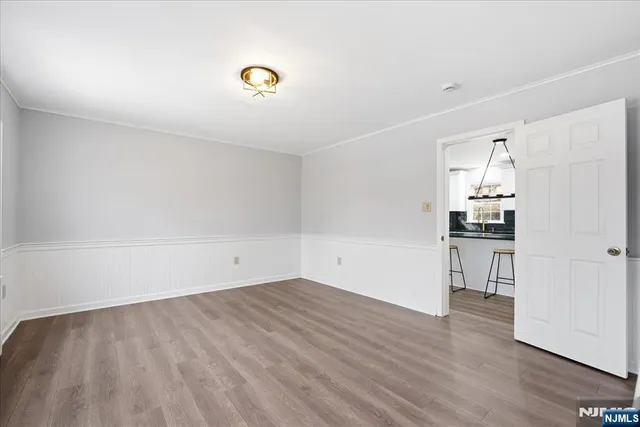 a bathroom with a sink mirror vanity and toilet