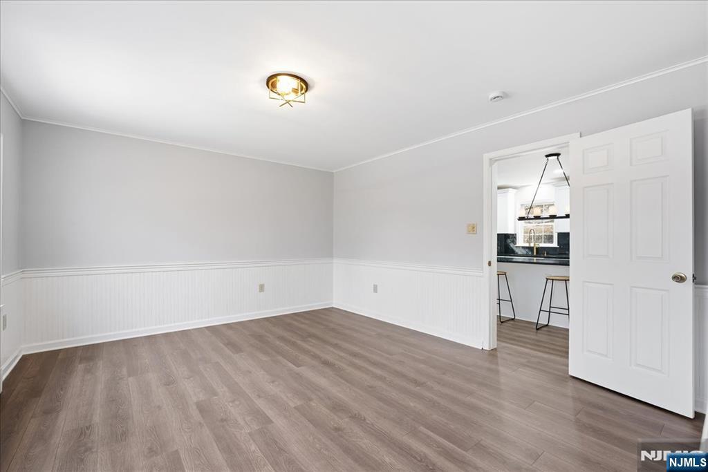 611 Snake Den Road West Milford, NJ 07480 - Photo 11 of 46 a view of a kitchen with wooden floor and a window