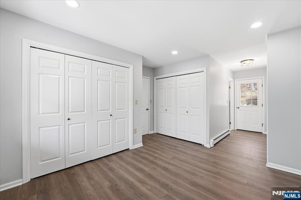 611 Snake Den Road West Milford, NJ 07480 - Photo 14 of 46 a view of an empty room with wooden floor