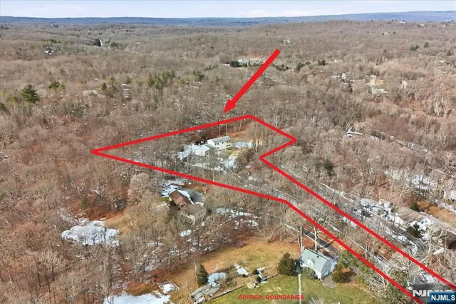 a kitchen with stainless steel appliances granite countertop a kitchen island hardwood floor sink stove and granite counter top