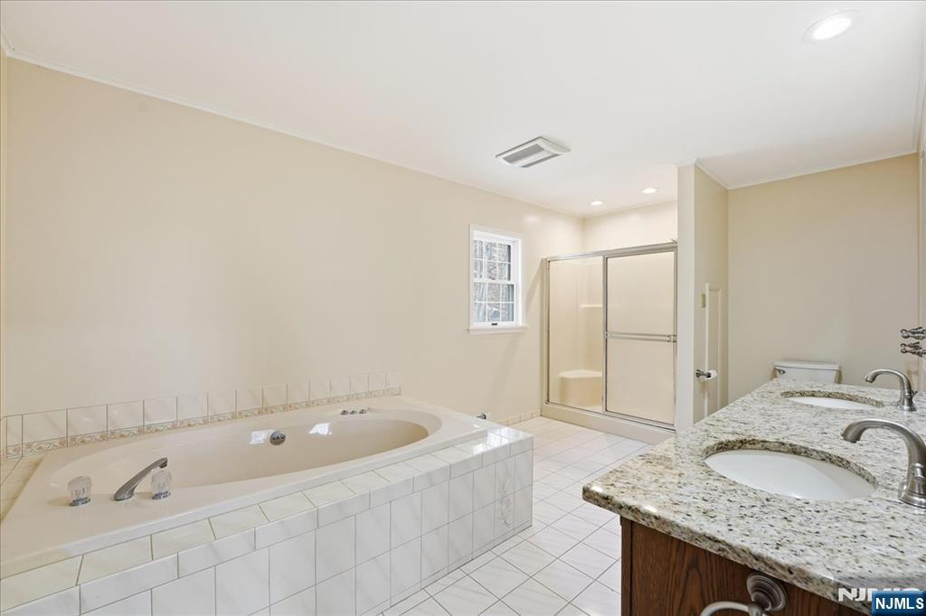 611 Snake Den Road West Milford, NJ 07480 - Photo 22 of 46 a bathroom with a granite countertop tub sink and mirror