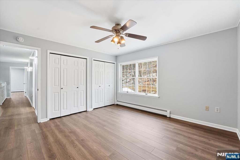 611 Snake Den Road West Milford, NJ 07480 - Photo 26 of 46 wooden floor in an empty room with a window