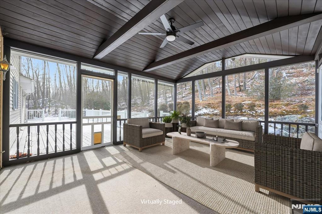 611 Snake Den Road West Milford, NJ 07480 - Photo 32 of 46 a view of a porch with furniture and wooden floor