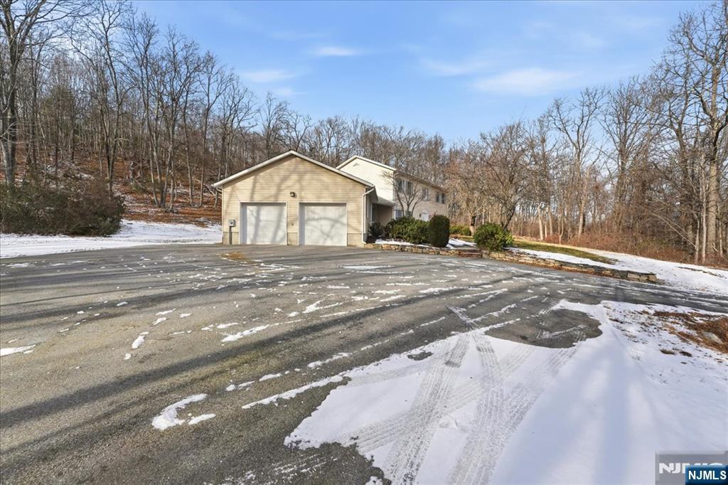 611 Snake Den Road West Milford, NJ 07480 - Photo 43 of 46 a view of large house with a yard