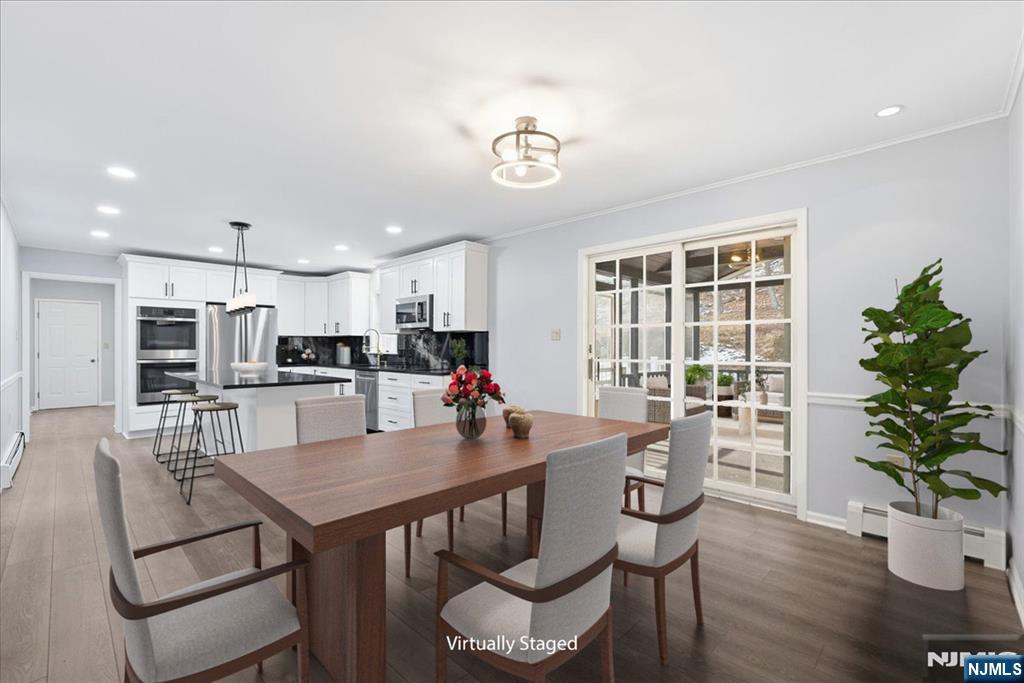 611 Snake Den Road West Milford, NJ 07480 - Photo 5 of 46 a dining room with furniture and wooden floor