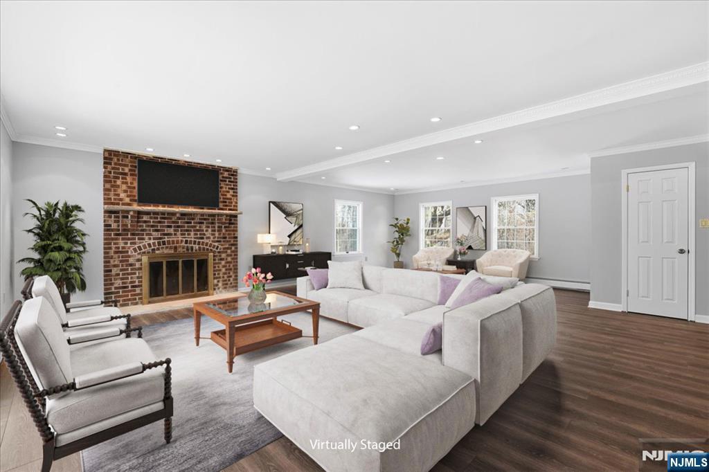 611 Snake Den Road West Milford, NJ 07480 - Photo 7 of 46 a living room with furniture a fireplace and a flat screen tv