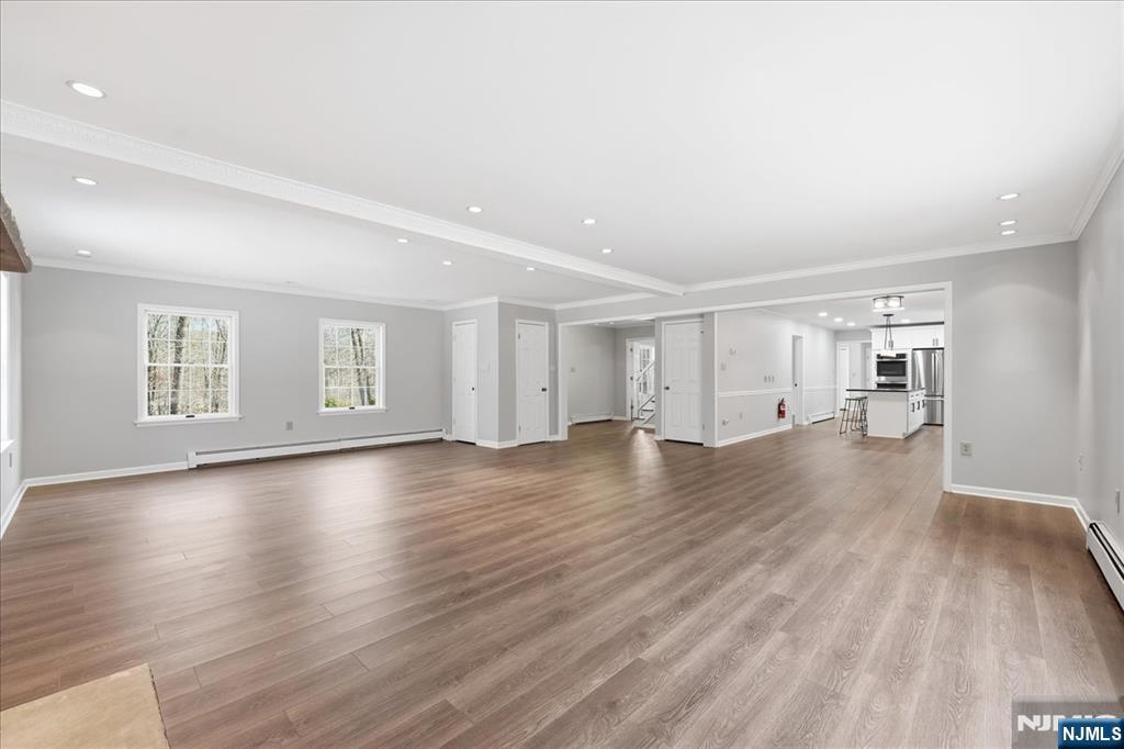 611 Snake Den Road West Milford, NJ 07480 - Photo 10 of 46 a view of empty room with wooden floor