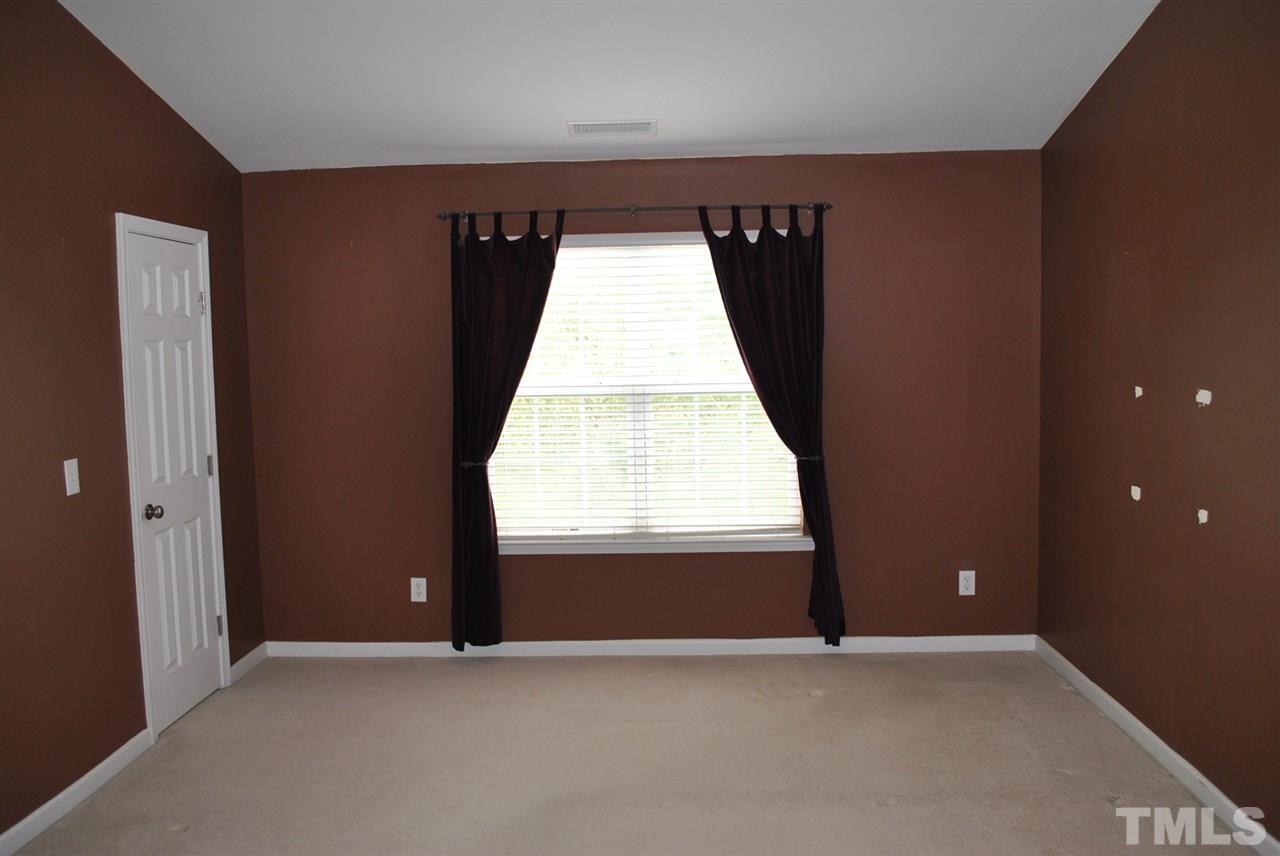 8234 Belneath Court Raleigh, NC 27613 - Photo 12 of 20 an empty room with windows