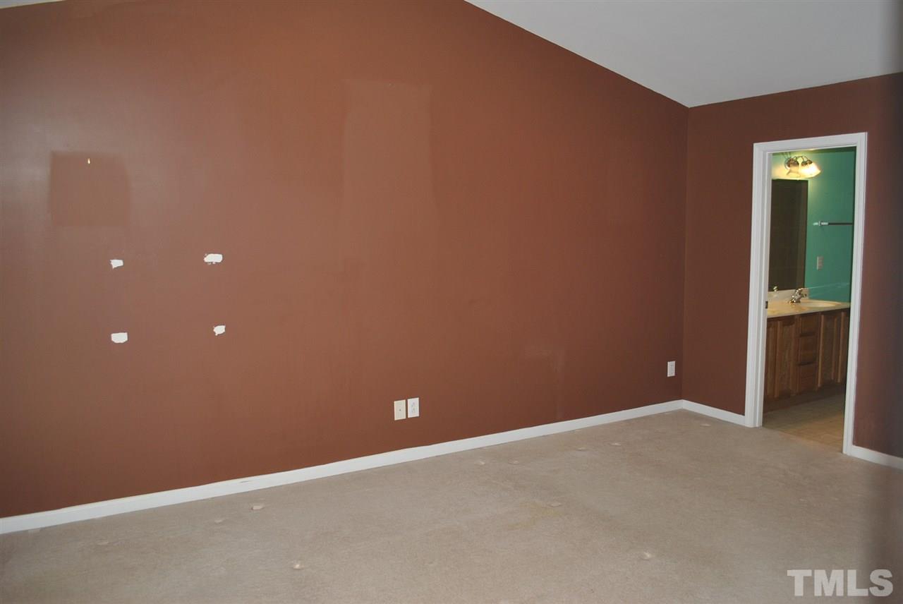 8234 Belneath Court Raleigh, NC 27613 - Photo 13 of 20 a view of an empty room with an empty space