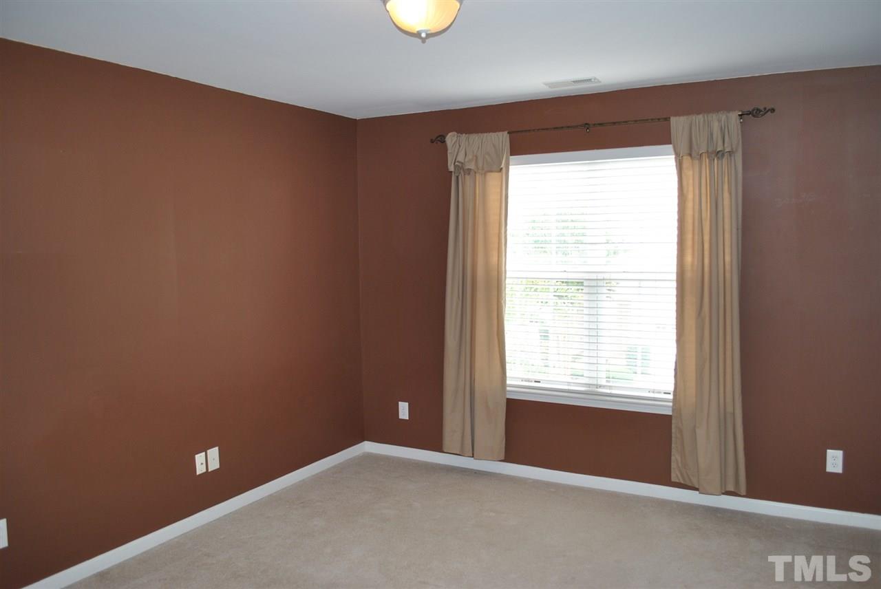 8234 Belneath Court Raleigh, NC 27613 - Photo 16 of 20 a view of an empty room with a window